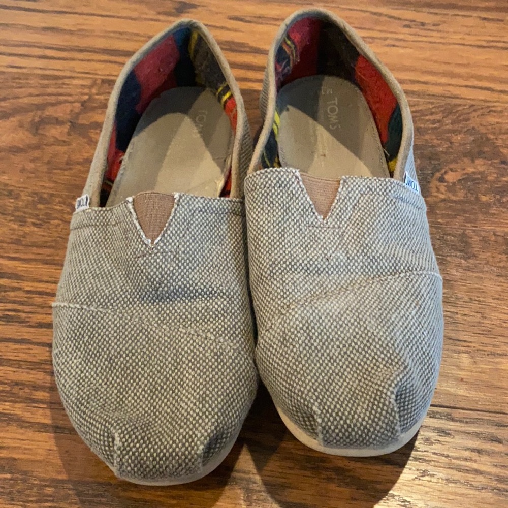 Tom’s brown slip-ons